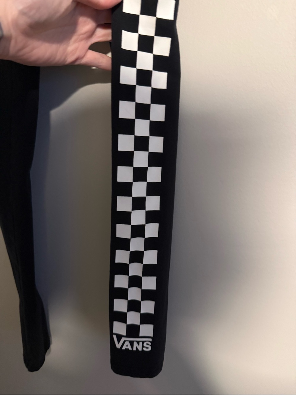 Vans Black Leggings with White Checkerboard Stripe on one leg
